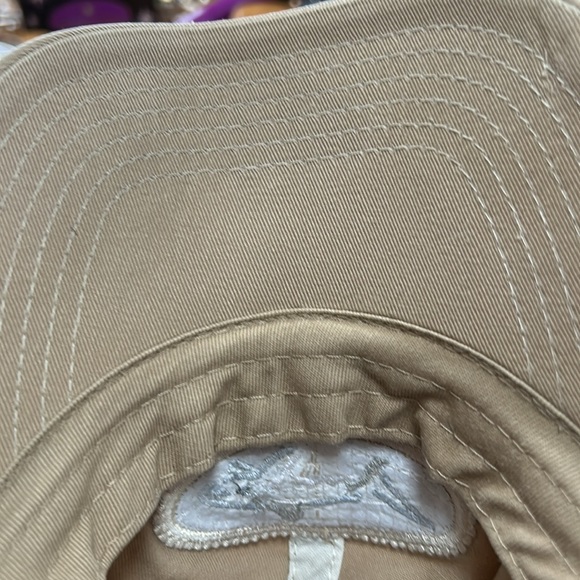 Greg Norman brand tan cap.  Velcro to adjust size in back.  Good condition. OS - Picture 8 of 8